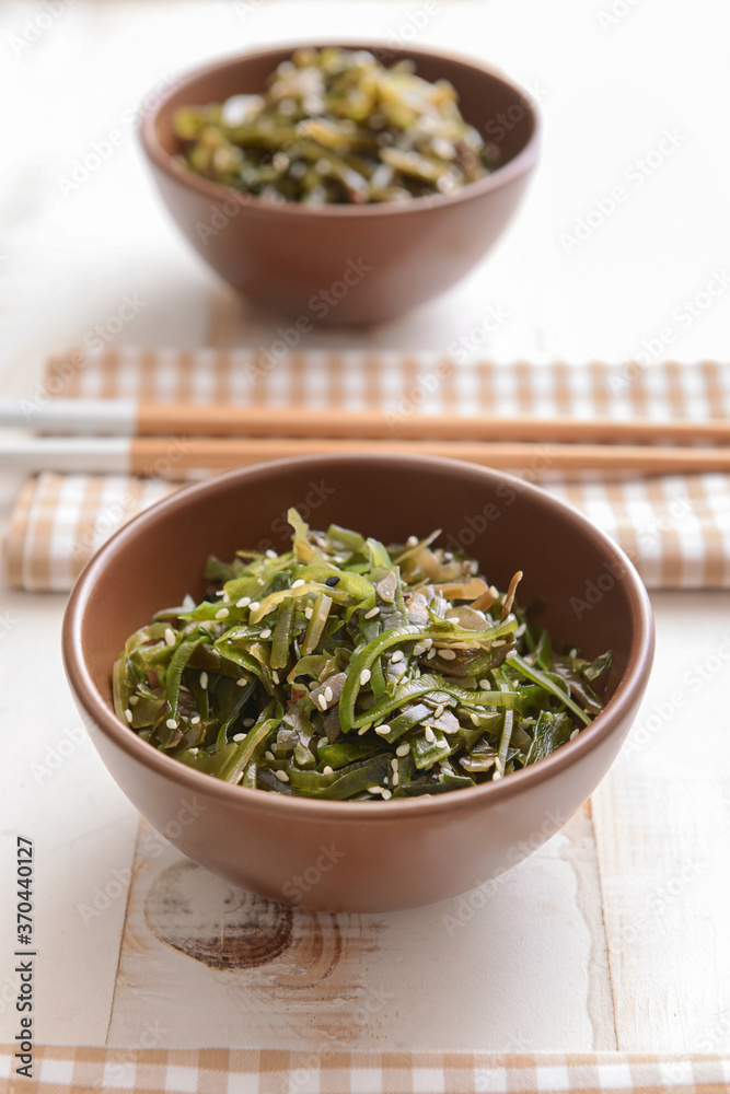 Bowl with tasty seaweed on table Bowl with tasty seaweed on table