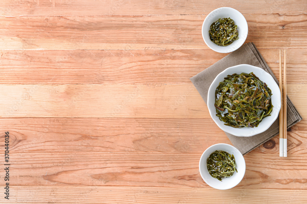 Bowls with tasty seaweed on table Bowls with tasty seaweed on table