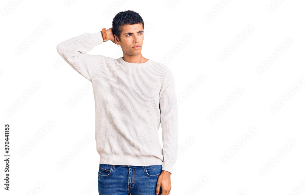 Young african amercian man wearing casual clothes confuse and wondering about question. uncertain with doubt, thinking with hand on head. pensive concept. Young african amercian man wearing casual clothes confuse and wondering about question. uncertain with doubt, thinking with hand on head. pensive concept.