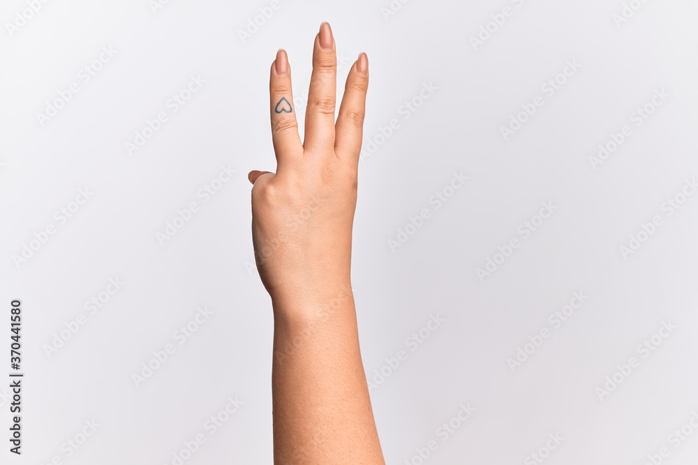 Hand of caucasian young woman counting number 3 showing three fingers Hand of caucasian young woman counting number 3 showing three fingers