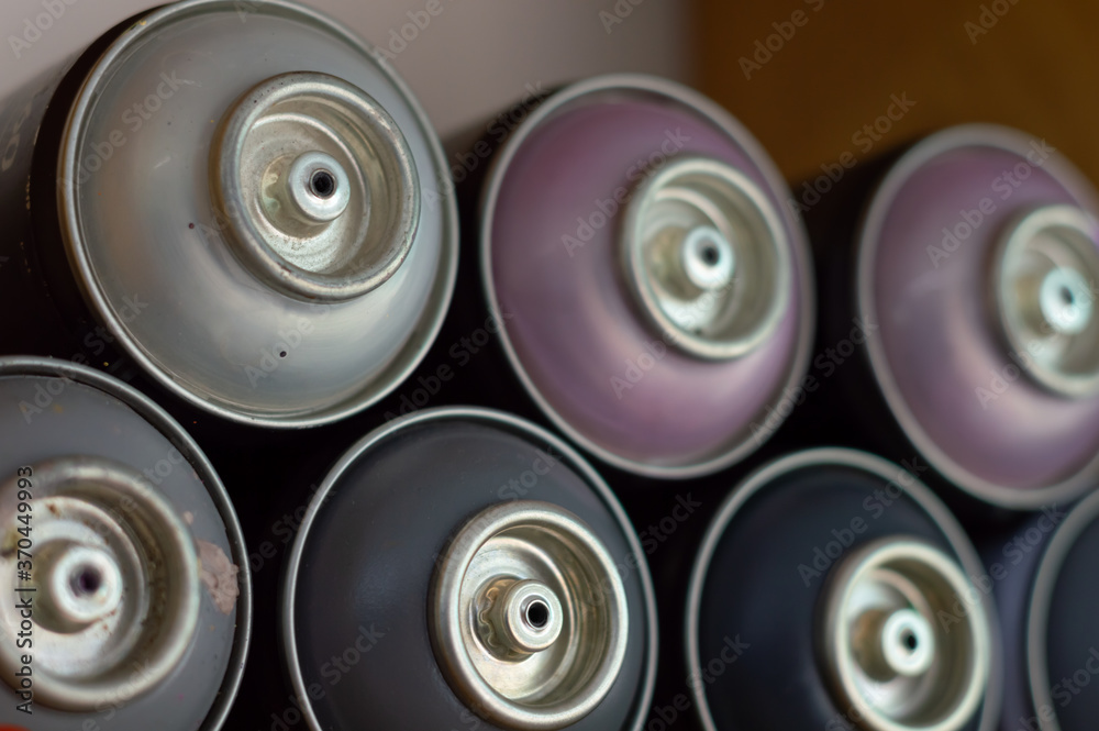 Closeup shot of different colors of spray paints Closeup shot of different colors of spray paints