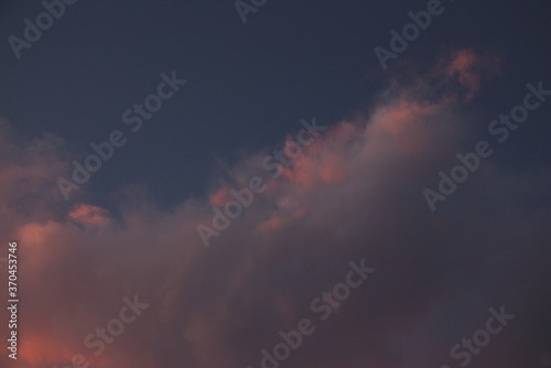 A huge pink cloud shot at dusk.