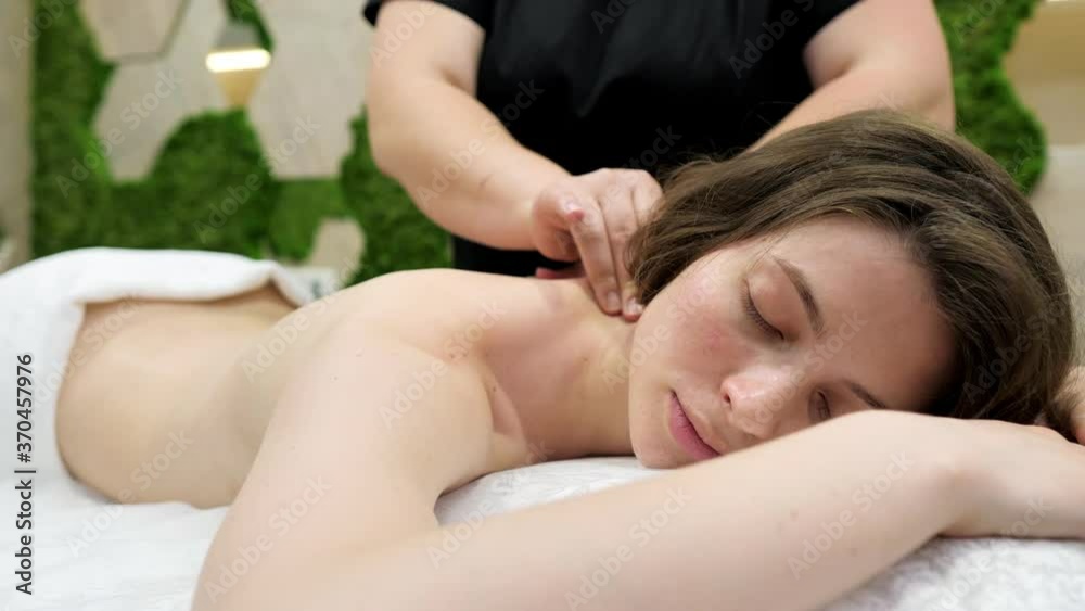 Beautiful young girl having massage in spa salon Beautiful young girl having massage in spa salon
