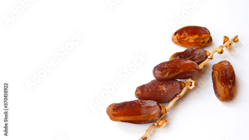 Dates fruit isolated on a white background. Top view. Flat lay pattern.