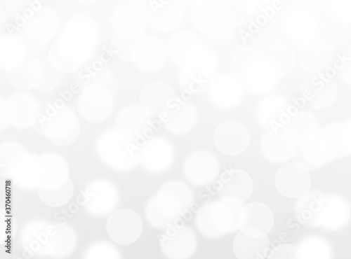 silver bokeh beautiful blurred glitter light on abstract background. grey wallpaper. 