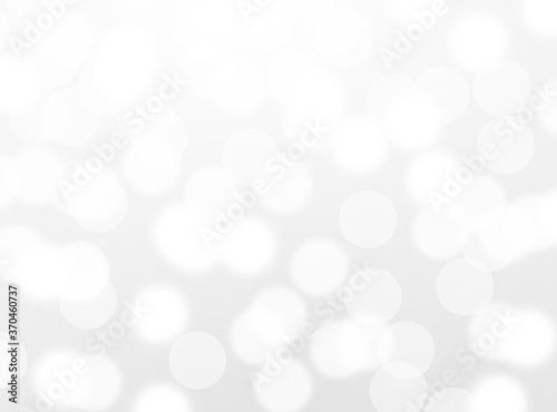 silver bokeh beautiful blurred glitter light on abstract background. grey wallpaper. 