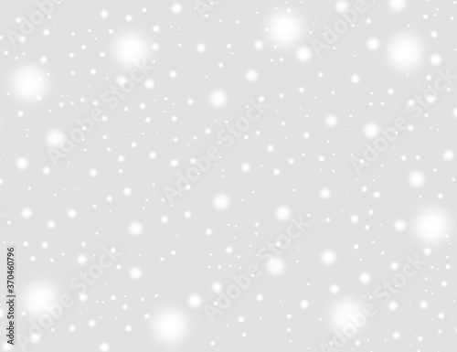A brilliant gray background with circles. Template for a holiday card with bright and sparkling lights.