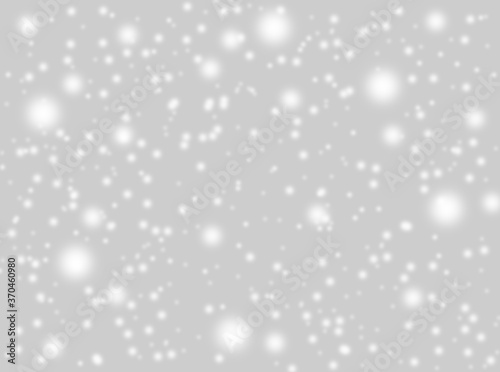 A brilliant gray background with circles. Template for a holiday card with bright and sparkling lights.