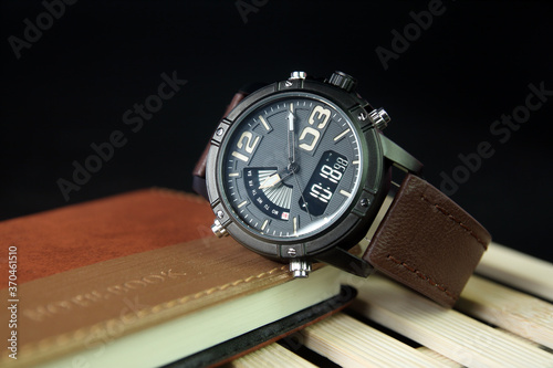 Men's wrist watch on Notebook or Business Planner 