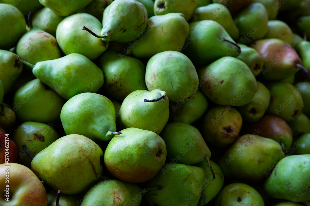 Closeup of fresh ripe pears in abundance. Fruit background..