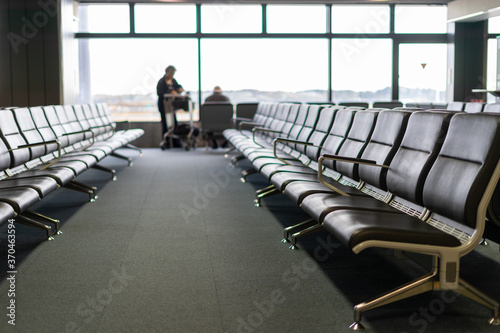 Empty seats in the departure lounge at the airport  © chongsiri