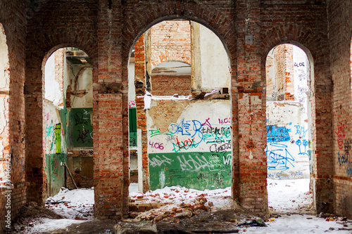 Odessa, Ukraine - 11 March 2013: Old building falling apart with broken windows, walls covered with cracks and scratches