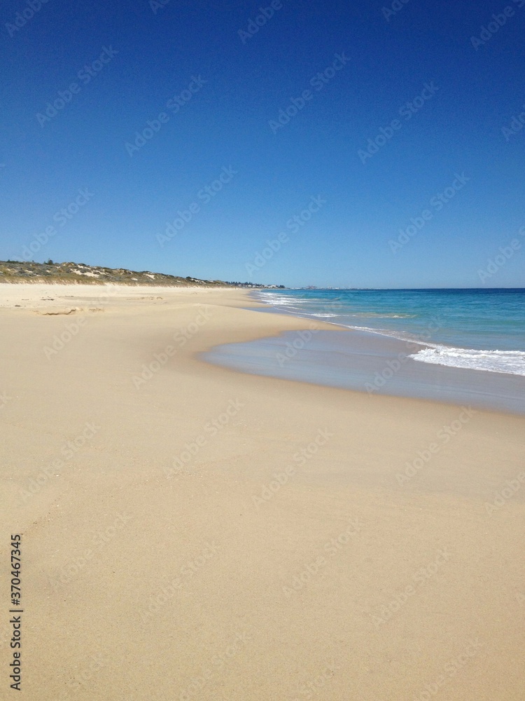 Empty sand beach and blue sky in Perth Australia