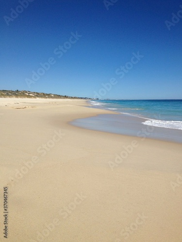 Empty sand beach and blue sky in Perth Australia