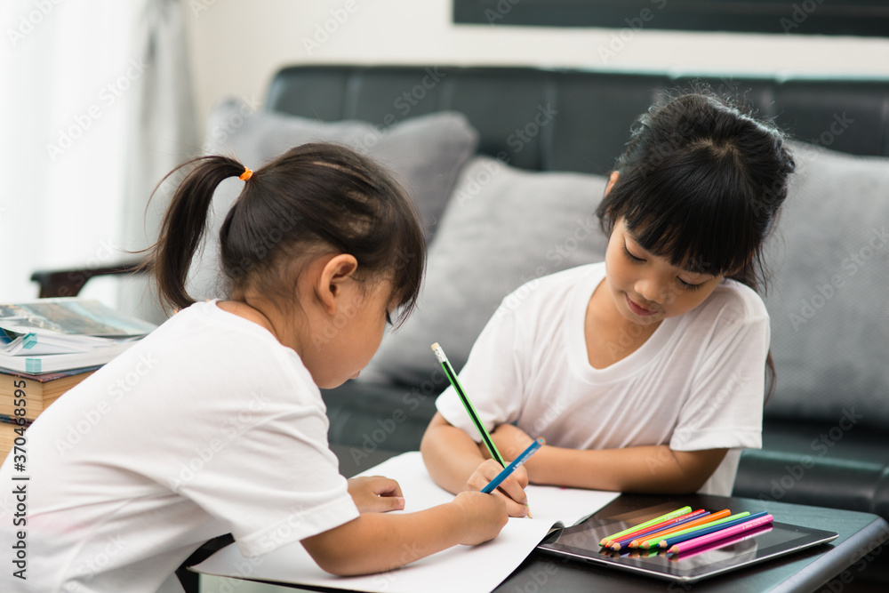 Covid-19 Coronavirus and Learning from home, Home school kid concept. Little children study online learning from home with laptop. Covid-19 Coronavirus and Learning from home, Home school kid concept. Little children study online learning from home with laptop.