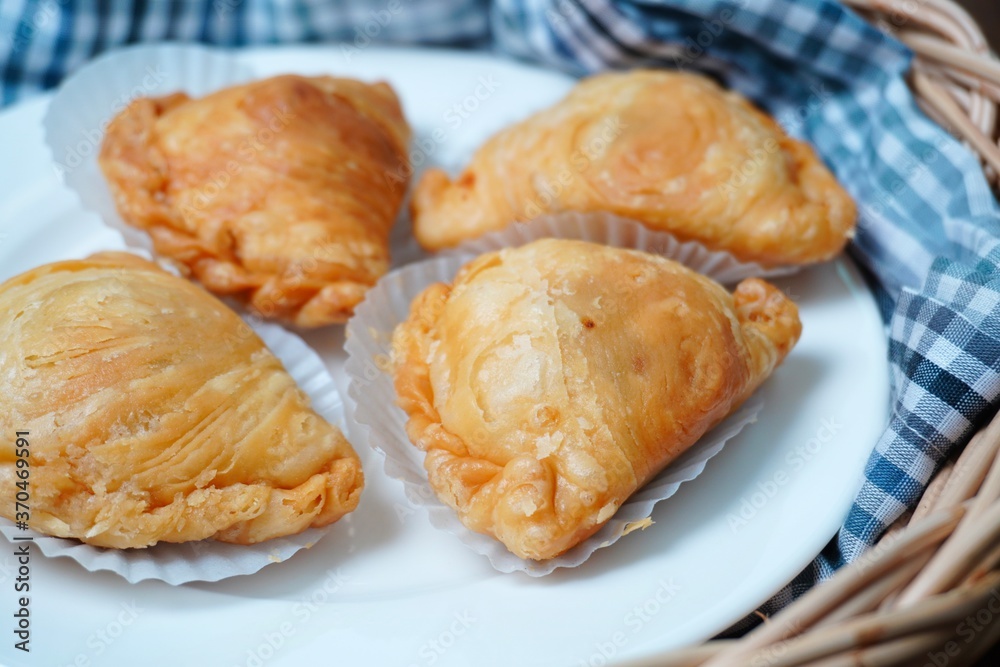 Thai curry puff pastry stuffed with chicken inside