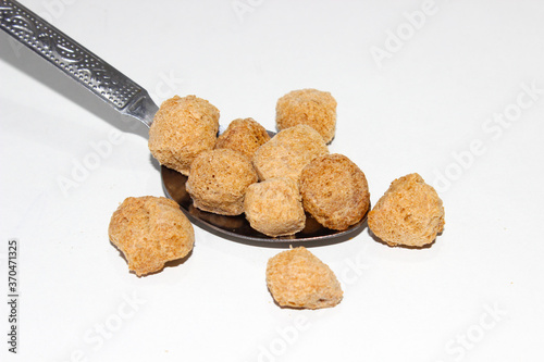 A picture of soya chunks on white background photo