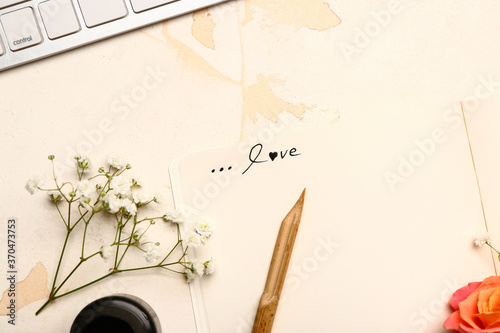 Vintage composition with pen and letter on white background