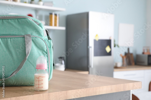 Bag and bottle of milk for ...