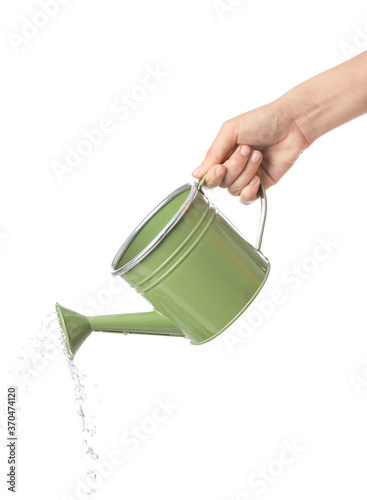 Quadro su tela Hand with watering can on white background