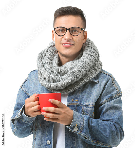Handsome young man with cup...