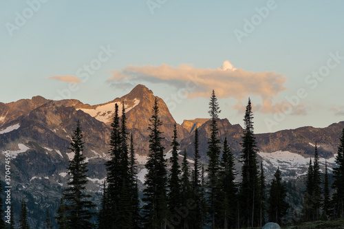 Mountain range at the sunset, rocky mountains, Valhalla Provincial Park, West Kootenays, BC, Canada. Pink an dred undertones, dramatic photo