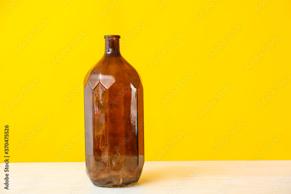 Beautiful vase on table against color background Beautiful vase on table against color background