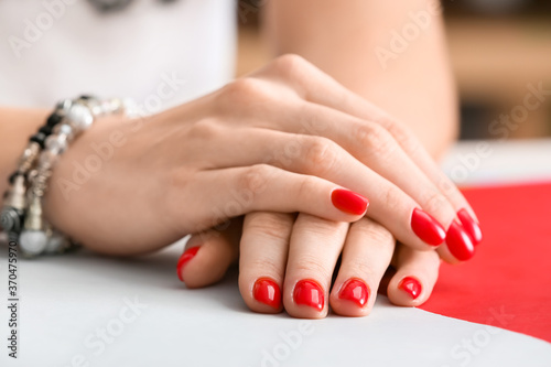 Hands with beautiful manicure on color background  closeup