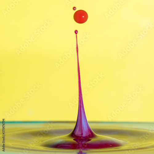 Beautiful abstract unique water drop splash photography images with vibrant colorful water collisions captured using high speed flash technique © veneratio