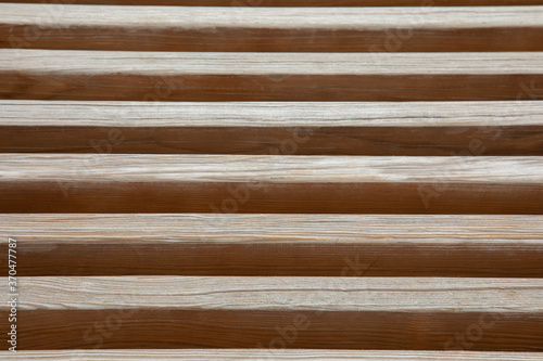 Close up and perspective view of wooden batten in vertical layer shows beautiful pattern and texture of wood material. It is attractive for using as background, backdrop and abstract art