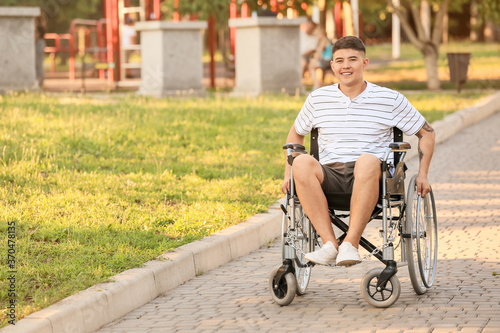 Young man in wheelchair out...