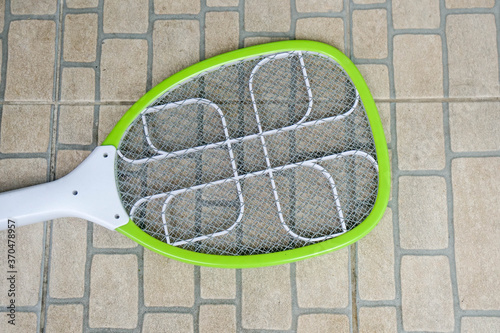 electric mosquito swatter at outdoors garden photo