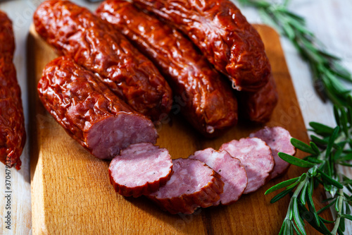 Close up of traditional Czech dried sausage on wooden surface