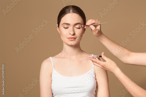 Makeup artist working with ...