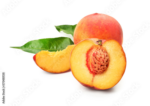 Sweet ripe peaches on white background