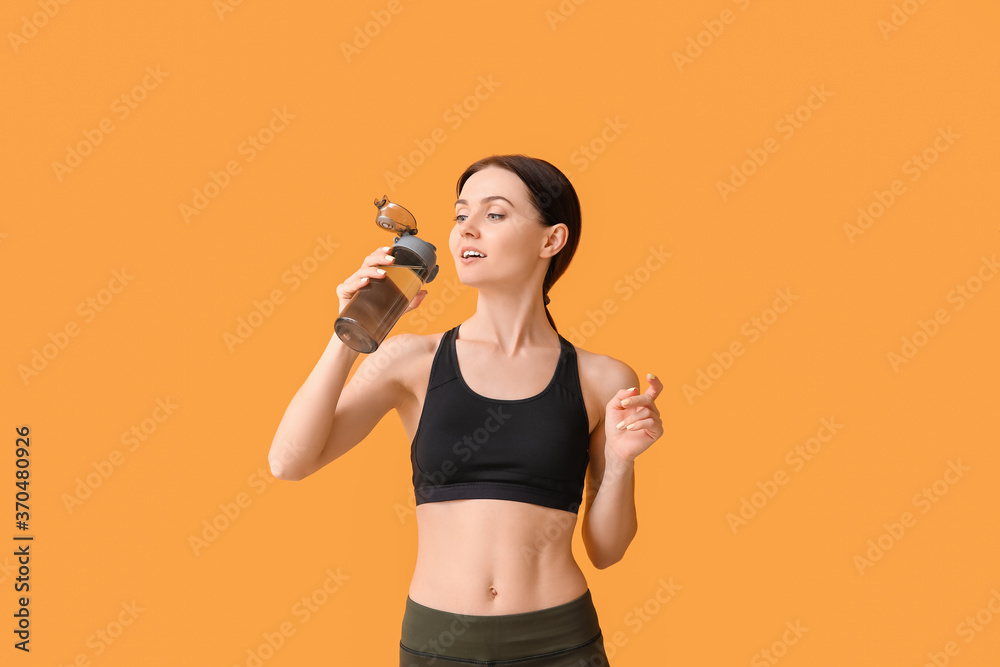 Sporty young woman with bottle of water on color background Sporty young woman with bottle of water on color background