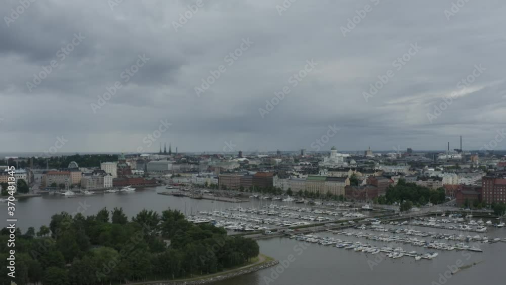 Drone view above port with many docked yachts and boats in Helsinki Finland.