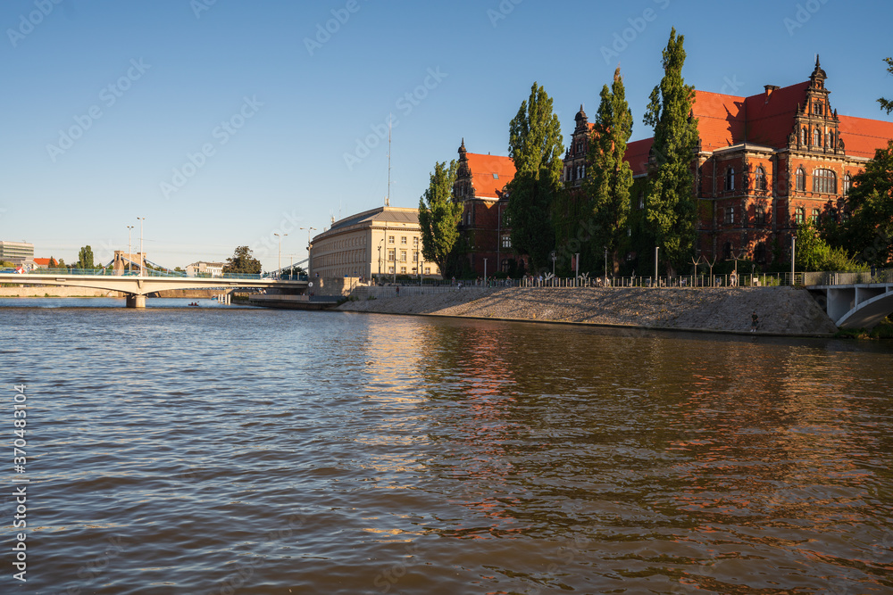 Naklejka premium Wroclaw, Poland August 5, 2020; View of the city of Wroclaw from the perspective of the Odra River.
