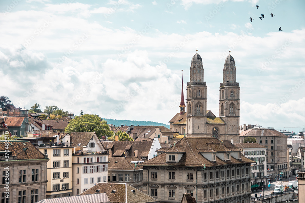 Beautiful views of Zurich old town and Grossmunster from Linderhof hill. Switzerland