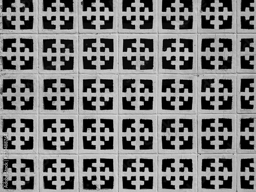 Wallpaper Mural Wall of decorative concrete blocks, making a geometric pattern of white against black.  Torontodigital.ca
