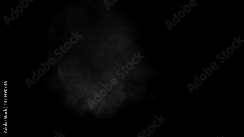 Low density smoke puff spreading concentrically outwards / Gunshot smoke / Shockwave smoke. Separated on pure black background, contains alpha channel. photo