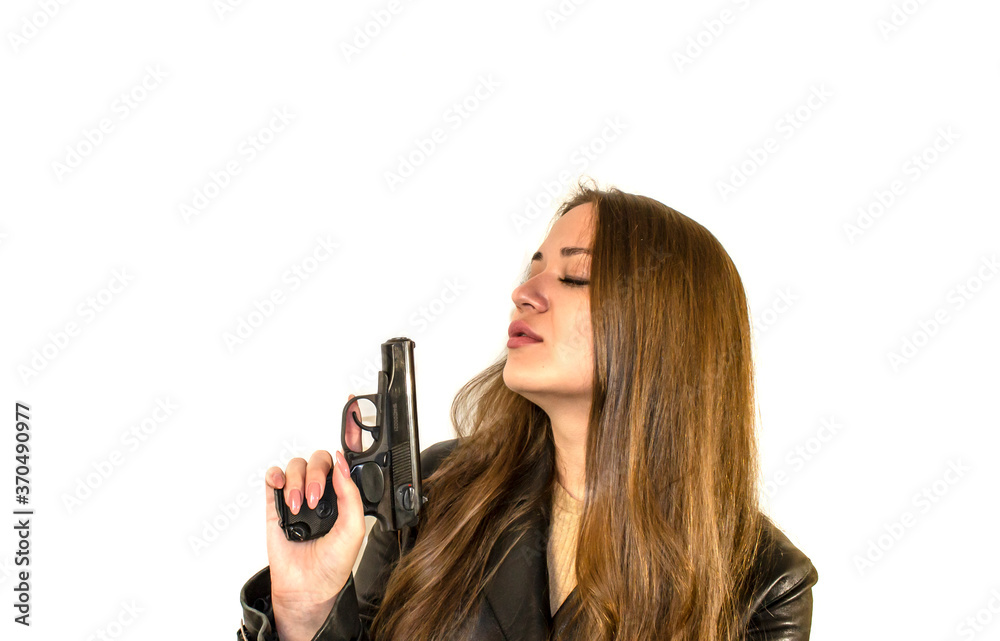 young beautiful girl with a pistol isolate on a white background young beautiful girl with a pistol isolate on a white background