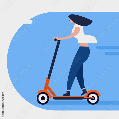 A girl rides an eco friendly non polluting electric scooter in the city