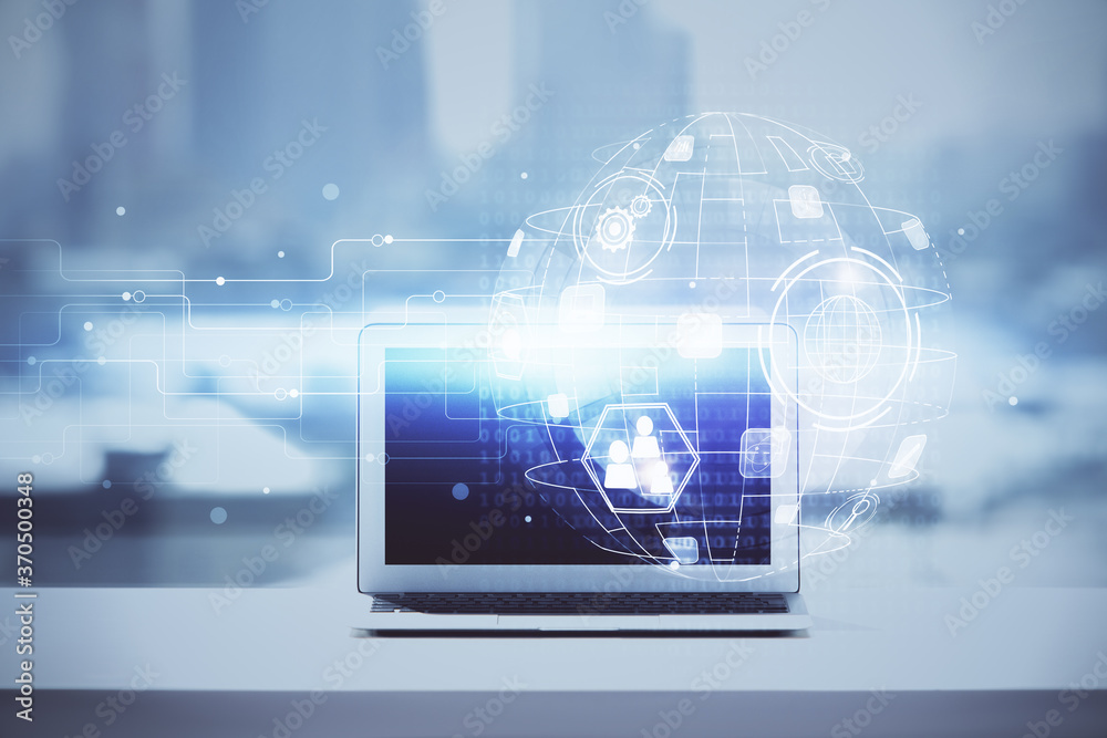 Computer on desktop with social network hologram. Double exposure. Concept of international people connections. Computer on desktop with social network hologram. Double exposure. Concept of international people connections.