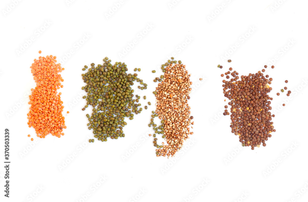 Top view on a white background of natural cereals, wheat, couscous, buckwheat, mung bean, lentils, consisting of barley, millet. Top view on a white background of natural cereals, wheat, couscous, buckwheat, mung bean, lentils, consisting of barley, millet.
