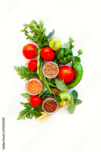 different vegetables and fruits on a white isolated background.