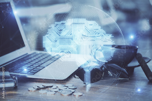 Multi exposure of work table with computer and brain hologram. Brainstorm concept.