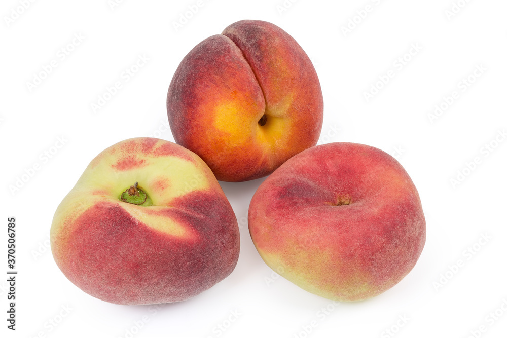 Flat peaches and ordinary peach on a white background Flat peaches and ordinary peach on a white background