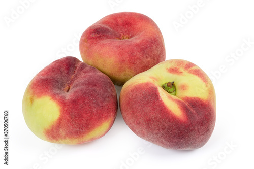 Flat peaches on a white background