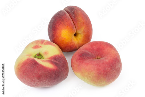 Flat peaches and ordinary peach on a white background